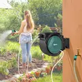 Outsunny Retractable Hose Reel Wall Mounted, 20+2m Garden Hose Pipe Reel with Lock, Auto Rewind, 7 in 1 Spray Nozzle, Includes Wall Fixings, 180° Swivel, Outdoor Watering, 59 x 20 x 39 cm, Black - 2
